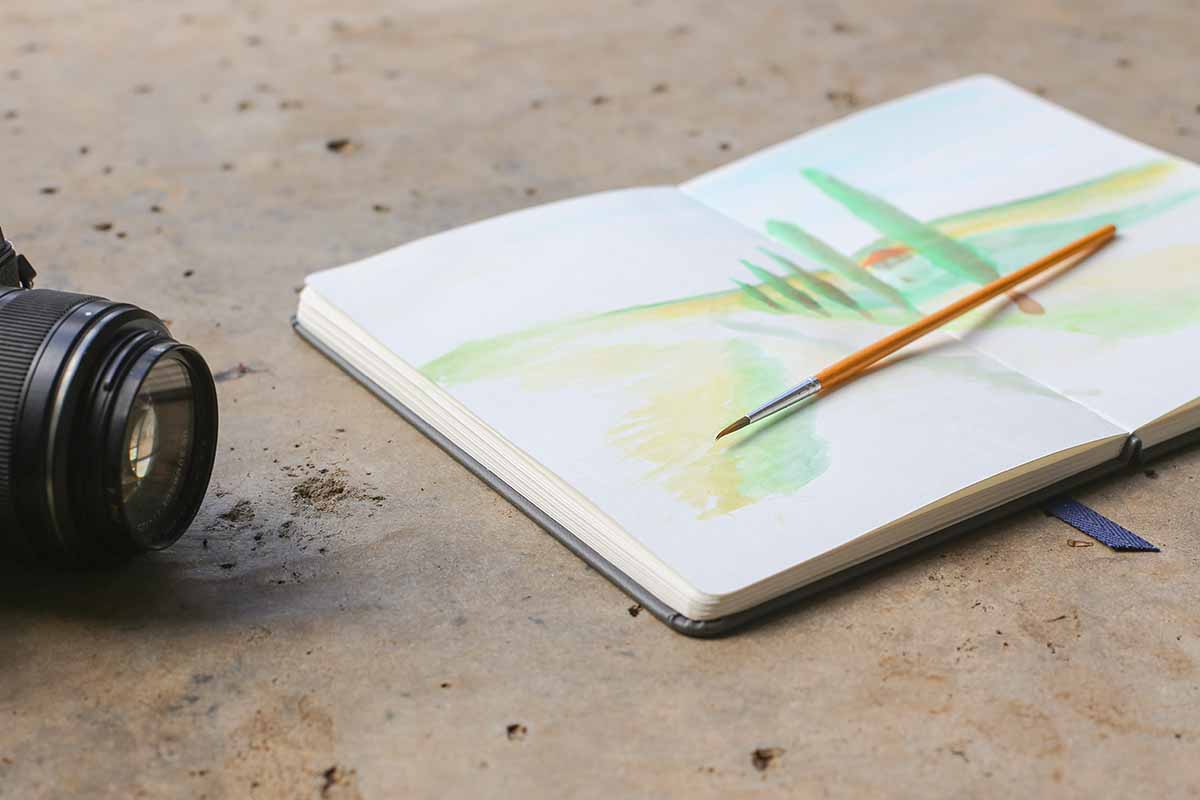 a keepbook with a watercolor drawing in it.