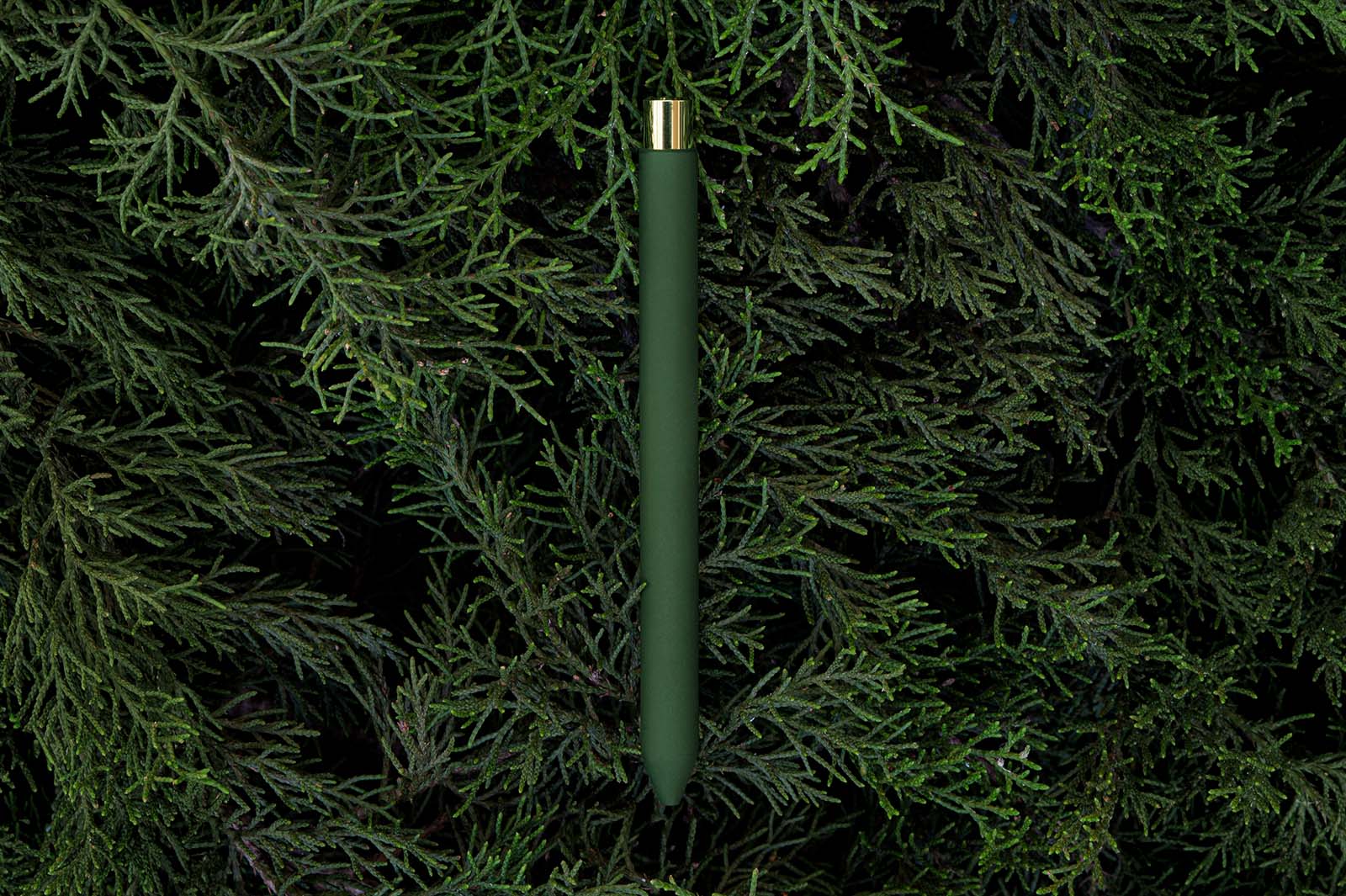 A mark one pen on pine boughs.