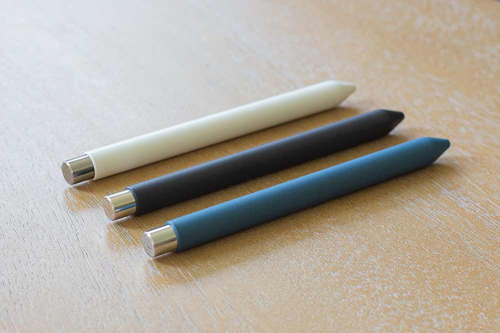 A white, black, and blue version of the Mark One on a table.