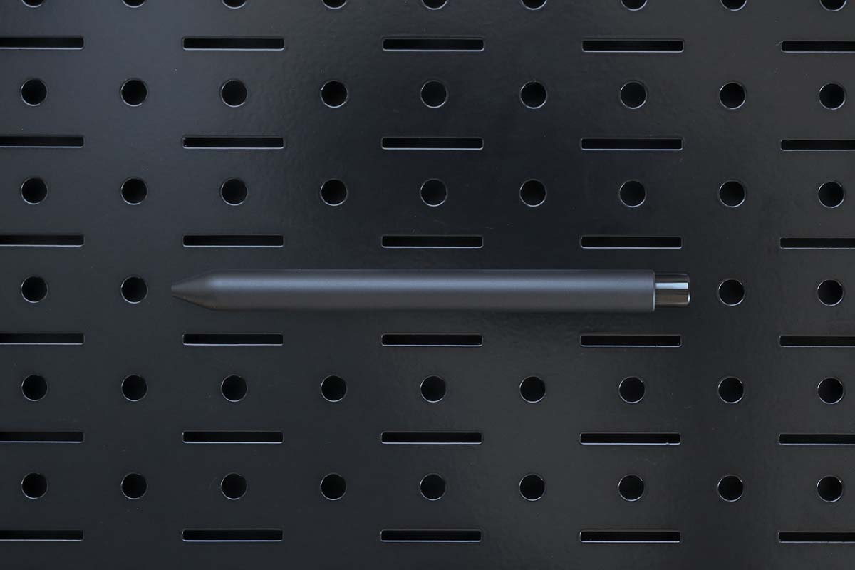 a black mark one on a black metal panel