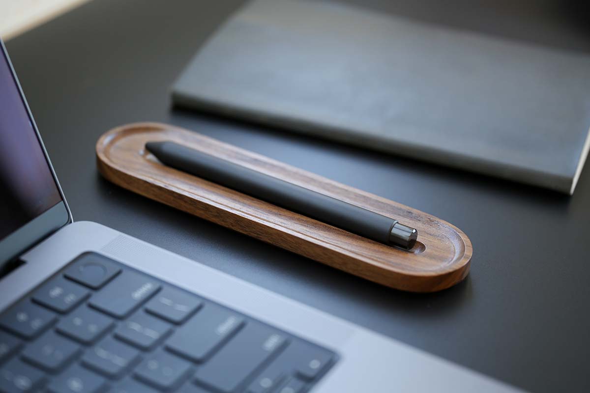 a steel mark one sitting on a tray next to a laptop